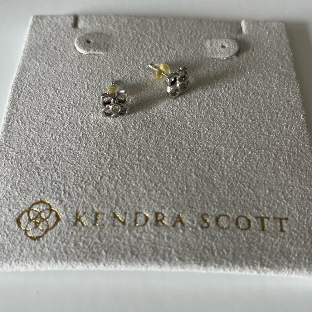 Kendra Scott Signature White Gold Floral Stud Earrings with tiny diamond
